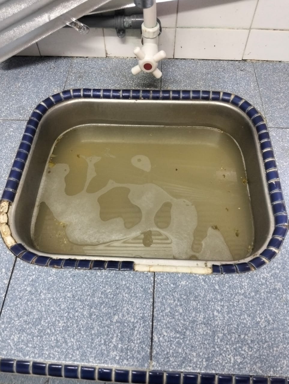 Blocked sink before cleaning