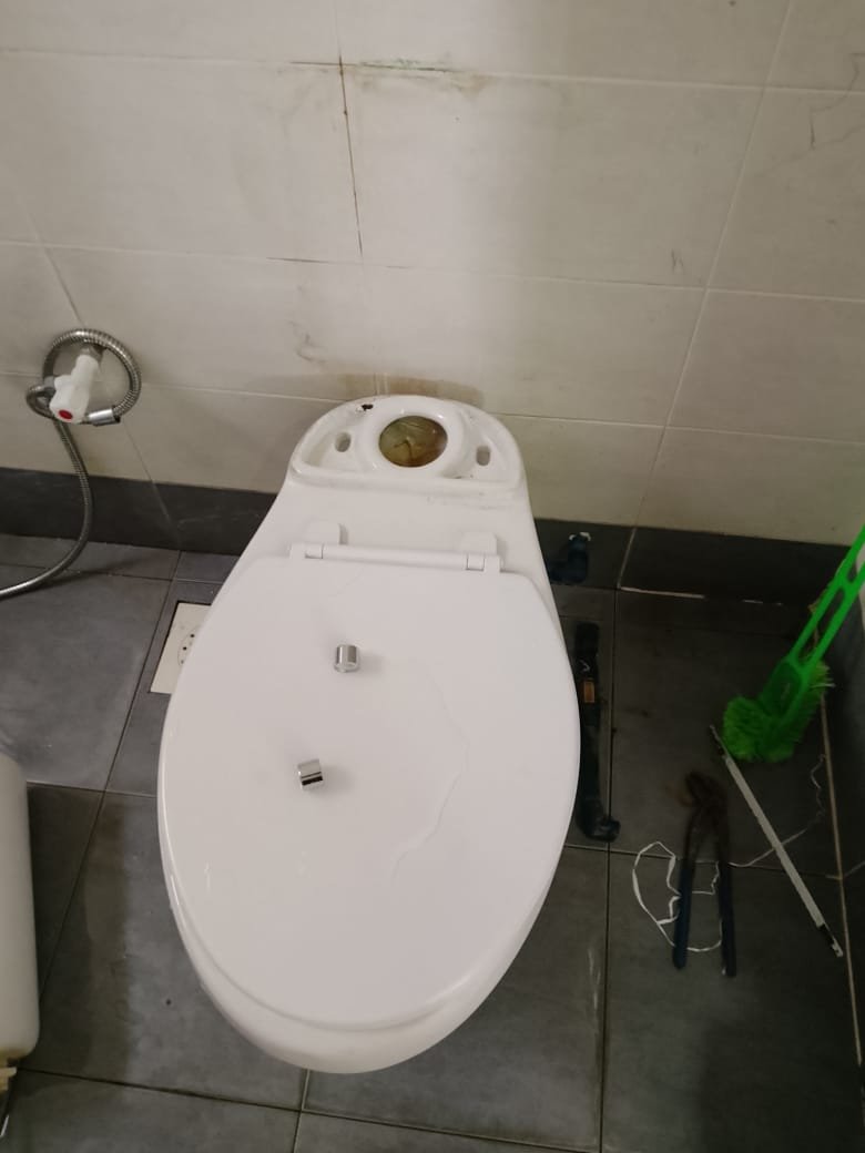 Plumbing work at a toilet